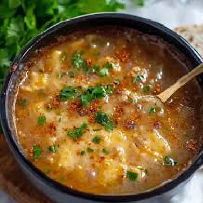 image of Chorba Hamra bel Frik (Algerian Lamb, Tomato, and Freekeh Soup)